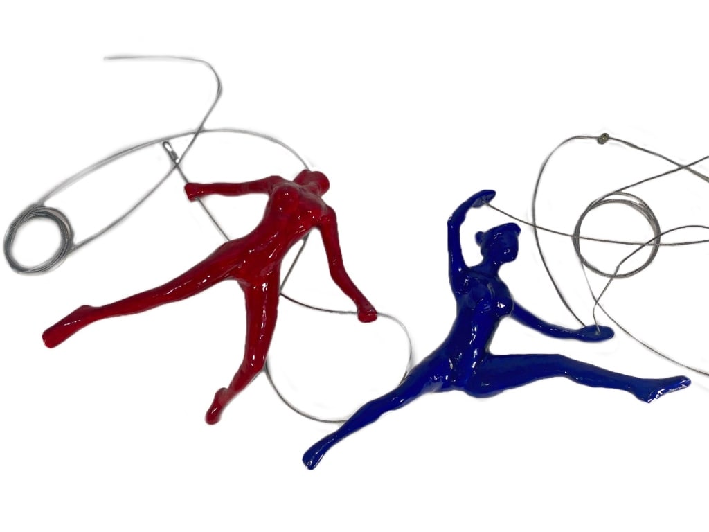 Blue & Red Glossy Resin Naked Mobiles 2pc LOT: Two acrobatic nude figures modeled as hanging mobiles. One in a deep blue color performing a split leap with one arm raised. The other done in bright red color in a dynamic running/lunging pose. These