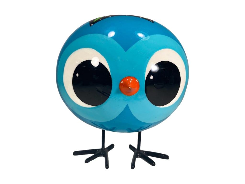 Art by Mele Hand Painted Floral Owl Sculpture: Whimsical spherical owl sculpture hand-painted with bold floral patterns, large expressive eyes, an orange beak, and metal legs. Signed 'Mele' in gold on the underside.Dimensions: 6.5 X 5 X in. Condit