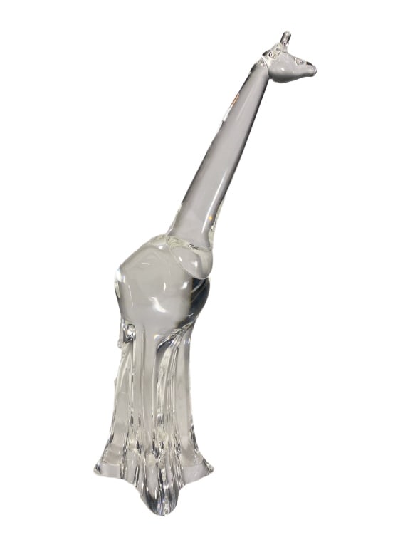 Steuben Clear Crystal Art Glass Giraffe Sculpture: Steuben clear crystal giraffe sculpture featuring a slender tapering neck, applied ossicones, and a stylized sculptural base. Signed 'Steuben' on the underside.Dimensions: 16.5 X 6.5 X 7.5 in. Conditi