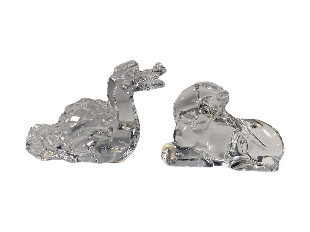 Baccarat Unicorn & Zodiac Dragon Crystal Figurines: Baccarat pair of signed clear French crystal animal figurines. This lot includes a recumbent unicorn & a zodiac dragon with a textured scaled back. Each piece bears the acid-etched Baccarat logo signa