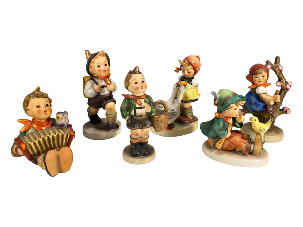Hummel Goebel German Porcelain Figurines 6pc LOT: Estate group of six German Hummel porcelain figurines by Goebel, showing children in various endearing scenes. All marked on their undersides. The largest measures approximately 4.5 inches tall by 2.5