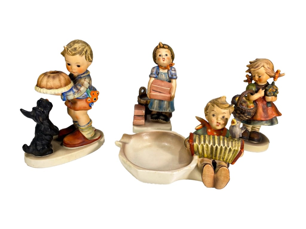 Hummel Goebel German Porcelain Figurines 4pc LOT: Set of four Goebel Hummel figurines featuring children in traditional costume. All properly marked. The largest measures approximately 5.25 inches tall by 3.25 inches wide by 2 inches deep.Condition: