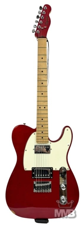 Squier by Fender Telecaster Electric Guitar w Case: Squier by Fender Telecaster electric guitar in red finish with white pickguard. Maple neck and fingerboard with dot inlays. Features dual pickups, three-way selector switch, and chrome hardware. Inclu