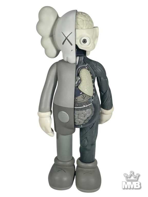 Kaws Companion Medicom Open Edition Toy: KAWS Companion vinyl figure by Medicom, Open Edition (2016). Half-dissected design reveals stylized anatomy brain, lungs, and organs on one side, contrasted with cartoon-inspired exterior on the other