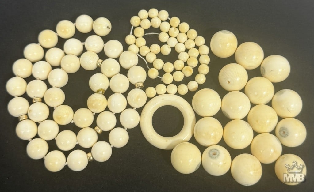 Collection of Carved Natural Material Beads & Ring: Grouping of loose hand carved natural material beads and components, including strands of spherical beads in graduated sizes, individual larger beads, and a circular close-looped ring element. The col