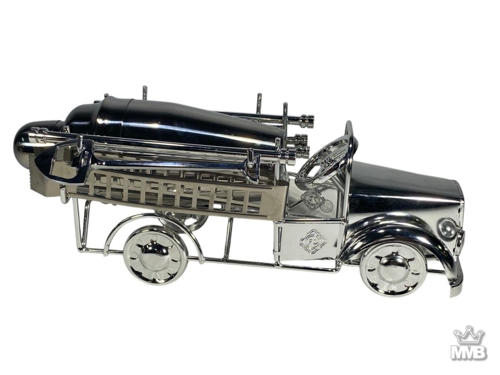 Godinger Fire Extinguisher Cocktail Shaker: Godinger silverplate barware set in the form of a vintage fire truck, with detachable fire-extinguisher cocktail shaker and bar tools in the truck bed. Stamped 'Godinger'.Dimensions: 5.5 X 9.75 X 5.5