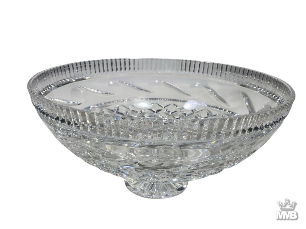 Waterford Killeen Clear Irish Crystal Fruit Bowl: Waterford clear cut Irish crystal fruit bowl designed with geometric and swirl motifs throughout on a raised circular footed base. Acid-etched 'Waterford' signature is present on its base. Dimensions:
