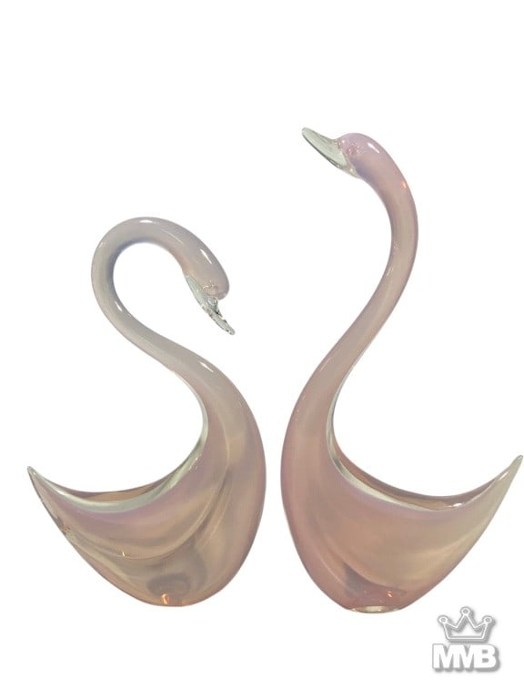 Elio Raffaeli Murano Art Glass Swan Figurines: Elio Raffaeli (Italian, born 1936) pair of hand-blown Murano glass swans in soft translucent pink with clear glass beaks, elegantly stylized with fluid curves. Each base etched 'Elio Raffaeli'.Dimensi