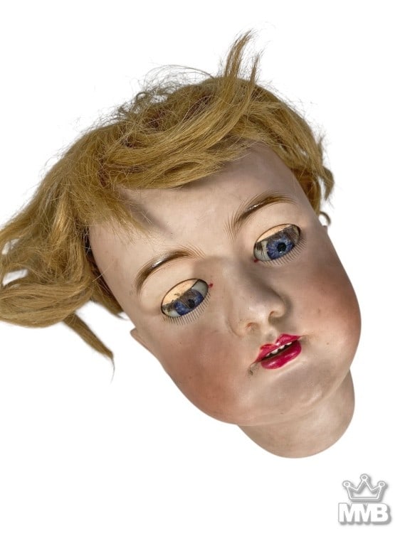 Antique French Tete Jumeau DEP 15 Porcelain Head: Tete Jumeau large bisque head, sleep blue paperweight eyes, finely painted brows and lashes, open mouth with four porcelain teeth, pierced ears, feathered brows, blush cheeks, red lips. Wig present on