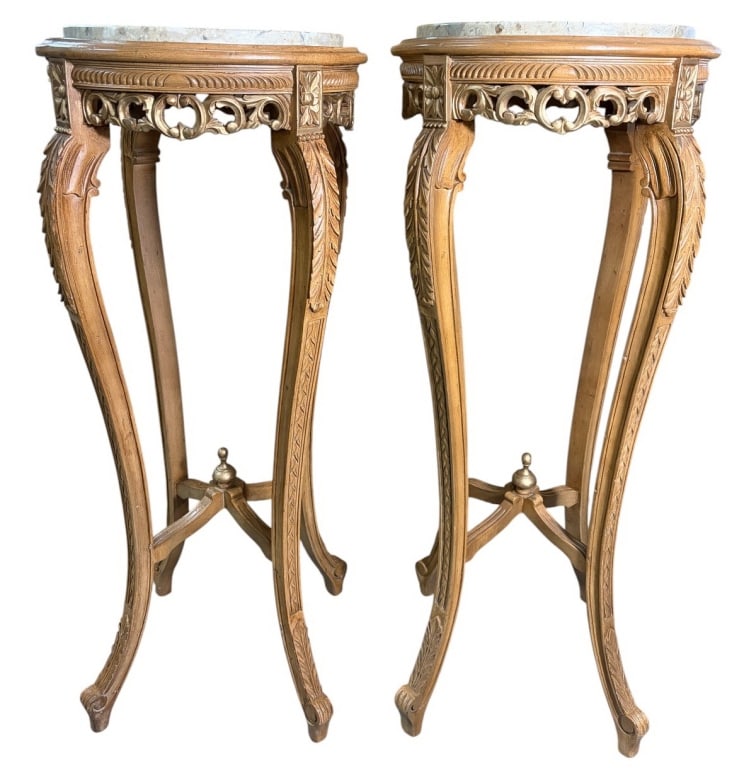 Pair of Carved Wood & Marble Top Pedestals: Pair of carved wood pedestals with round marble tops, pierced foliate aprons, acanthus-carved cabriole legs, and X-form stretchers with finials. Each piece measures approximately 36.25 inches high by 