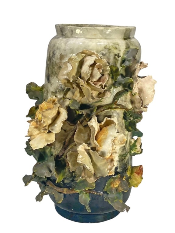 Large French Barbotine Flower Relief Faience Vase: French faience vase with applied barbotine roses and foliage in naturalistic tones on a mottled glaze ground. Impressed floral cartouche mark on underside.Dimensions: 15.5 X 9.5 X 10 in. Condition: