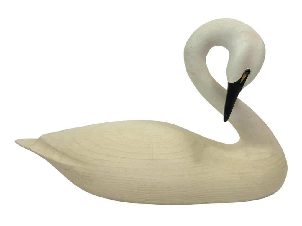 Ed Green Whistling Swan Hand-Carved Wood Sculpture: Ed Green (American, 20th century) hand carved wooden figural sculpture titled 'Whistling Swan'. Hand signed and stamp marked underneath its base. Dimensions: 10.5 X 16 X 6.5 in. Condition: Good ove