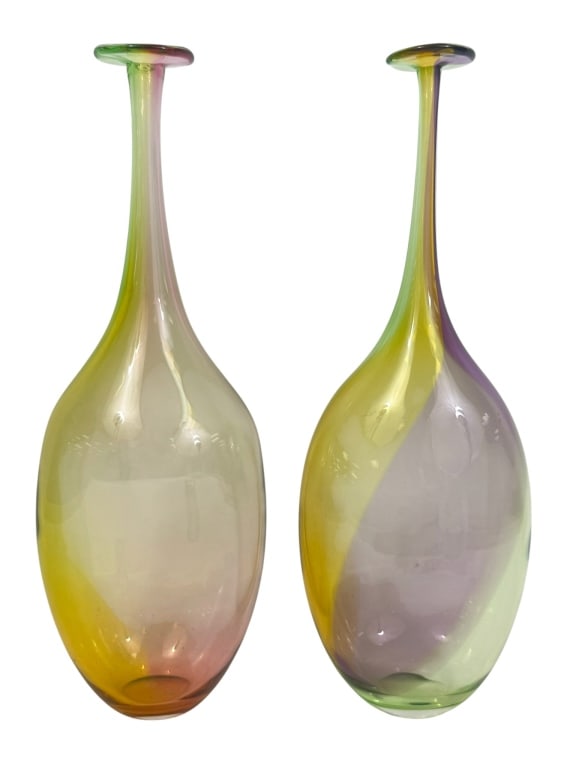 Pair of Kosta Boda Art Glass Vases by Kjell Engman: Pair of Kosta Boda Swedish hand blown art glass vases designed by Kjell Engman. Each vase features a tall, narrow neck flaring into a wide, rounded base with multicolor iridescent hues of green, yello