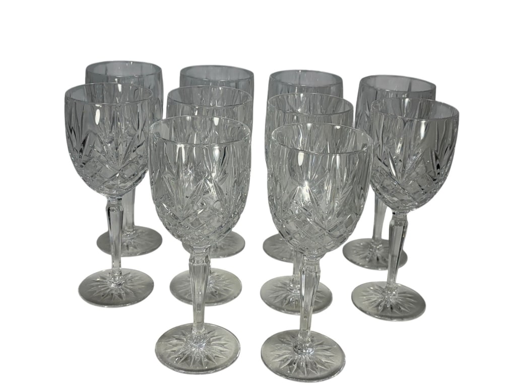 Waterford Marquis Style Crystal Glasses 10pc LOT: Elegant set of 10 cut crystal wine glasses in the Marquis style, decorated with diamond cross-hatch and vertical cuts, each resting on a starburst base. Each piece measures approximately 7.75 inches h