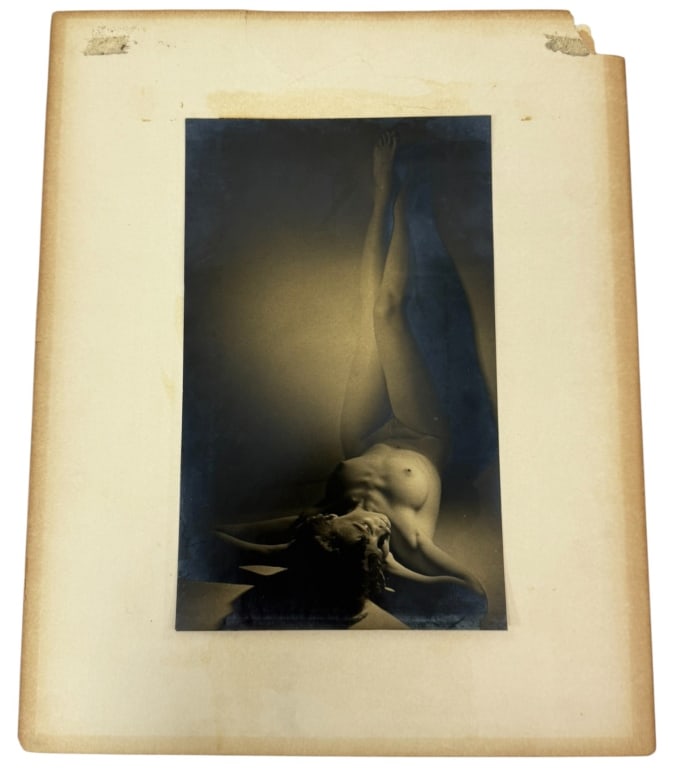 Silver Gelatin Pin-Up Photographs Style of Horst: Two vintage silver gelatin photographs mounted to its paper backing, featuring dramatic lighting and stylized poses reminiscent of Horst P. Horst (German/American, 1906 - 1999). One composition depict