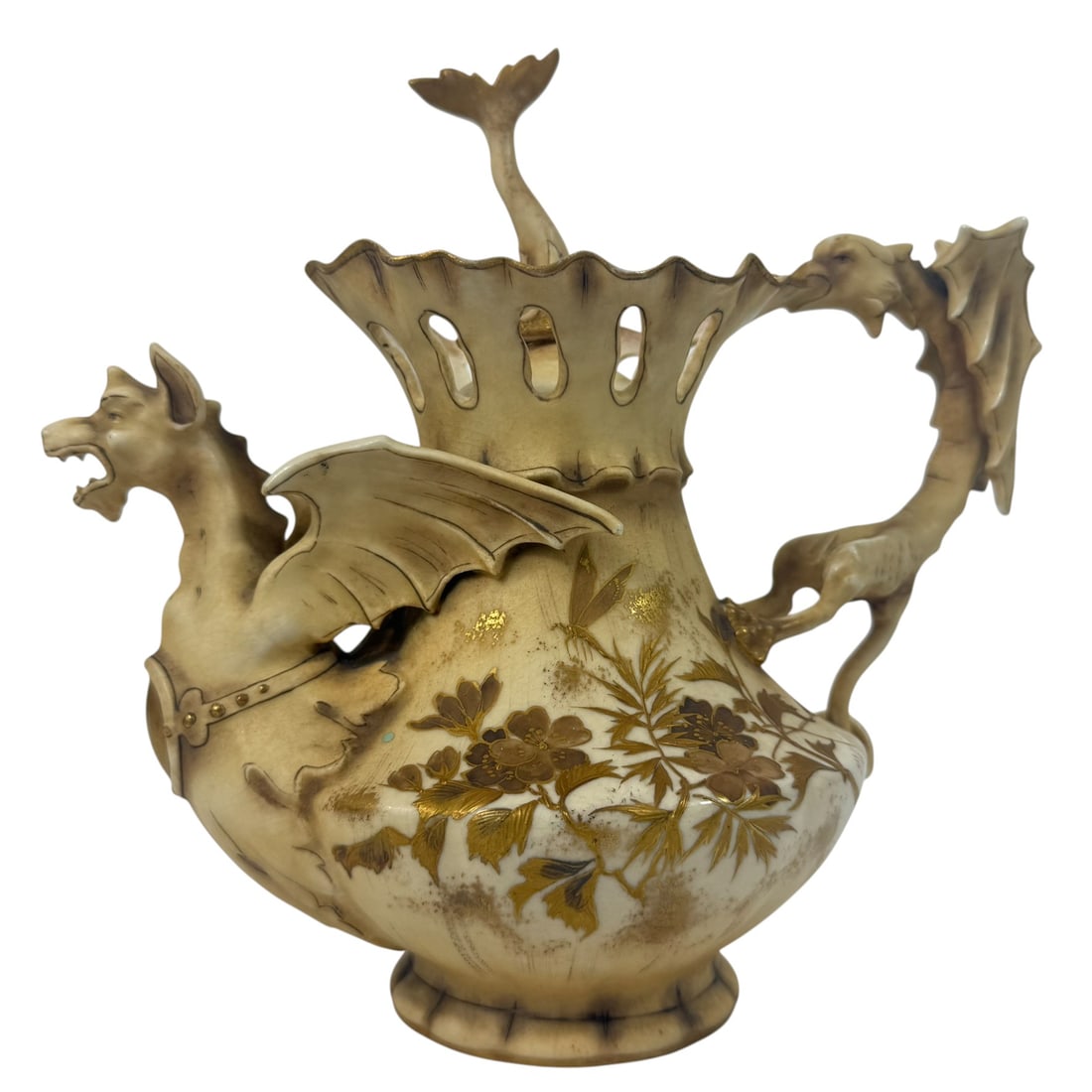 Alfred Stellmacher Teplitz Dragon Porcelain Teapot: Alfred Stellmacher (German, 19th century) Teplitz porcelain teapot featuring a fierce dragon forming the spout and handle with a figural dolphin finial to its lid. The body is finished in a rich ivory