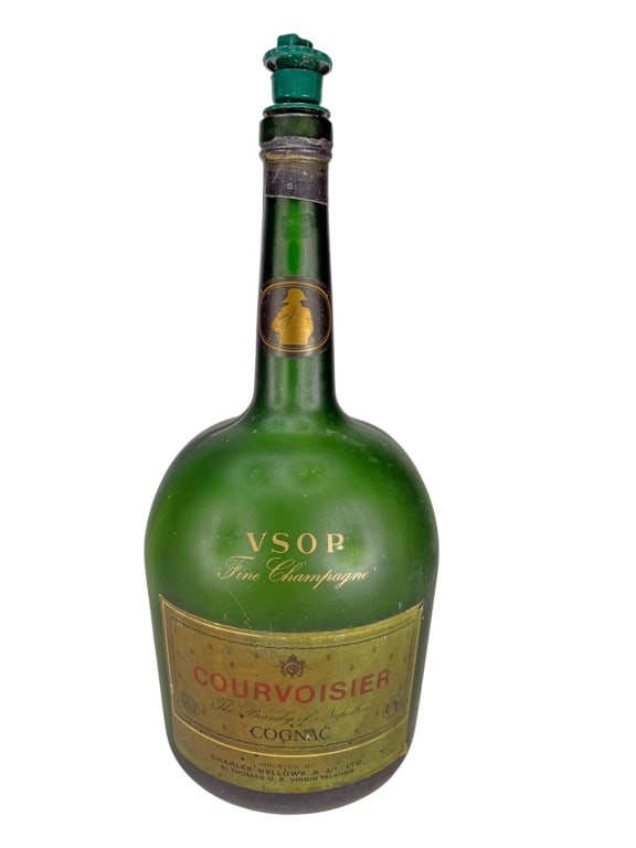 French Courvoiser Cognac Green Glass Bottle: French Courvoisier Cognac bottle in green glass with embossed markings and gilt red VSOP label. Original plastic stopper with embossed text and pour spout.Dimensions: 17 X 6.5 X 6.5 in. Condition:
