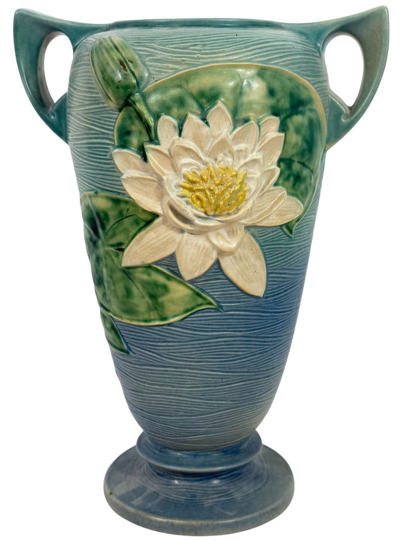 Roseville Pottery 16" Water Lily Blue Vase #83-15: Roseville American pottery 'Water Lily' vase, model #83-15. Featuring a raised white water lily blossom with green pads against a softly ribbed blue-glazed background. Circa: mid-20th century. Signed