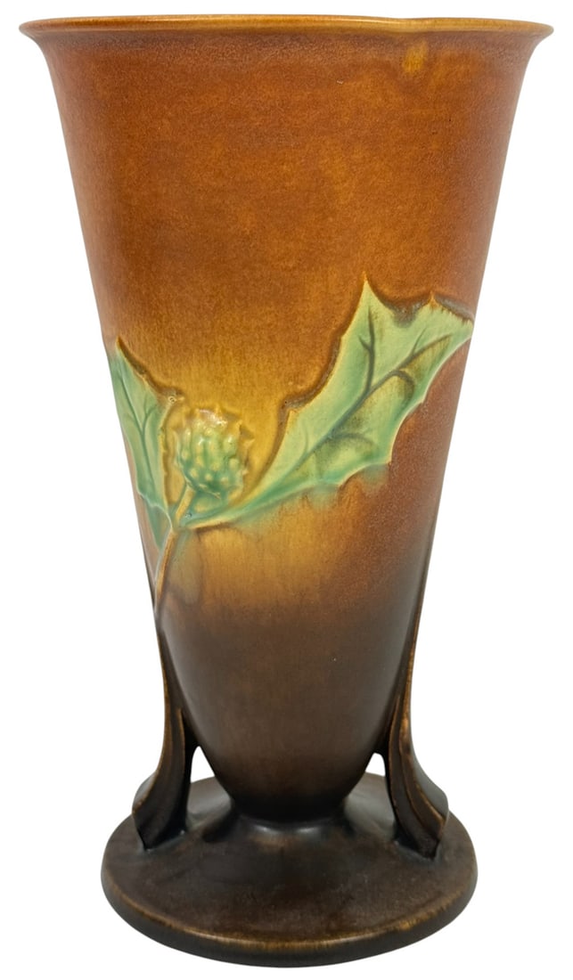 Roseville American Pottery Thornapple Vase #15-7: Roseville American pottery 'Thornapple' mid-century vase, featuring a sculptural design with flowing green leaves and stylized white blossoms on a rich brown-to-amber gradient background. The piece is