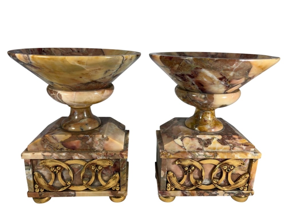 Pair of Bronze & Pink Violet Marble Tazzas: Pair of marble tazzas with pink, violet, and cream veining on square plinths, mounted with gilt bronze scrolls and ball feet. Each piece measures approximately 9 inches high by 7.25 inches wide by 7.2
