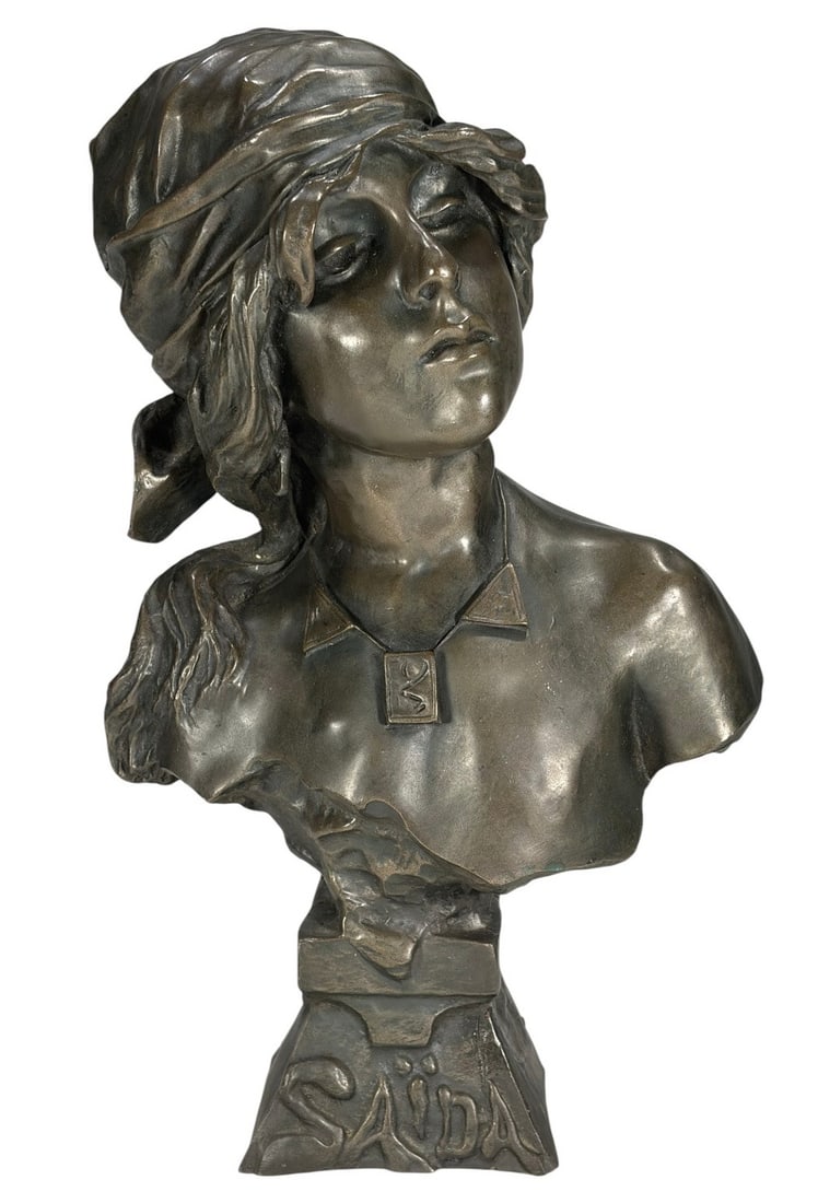 Sculptural Bust of 'Saida' after Emmanuel Villanis: Finely modeled composition bust sculpture after Emmanuel Villanis (French, 1858 - 1914) depicting Saida, a young woman in a headscarf and necklace with stylized pendant. Signed E. Villanis on its base