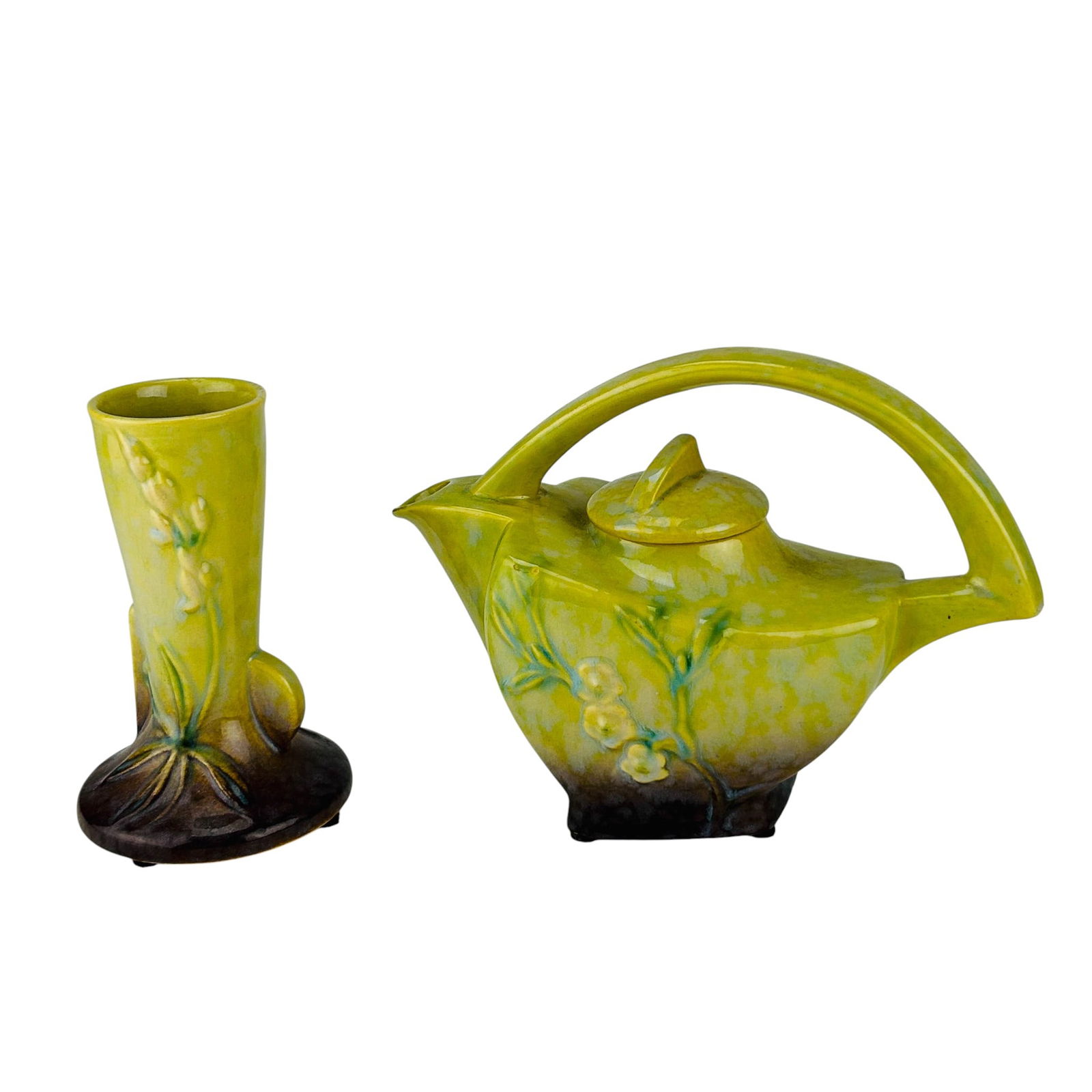Roseville Art Pottery Wincraft 1948 Vase & Teapot: Roseville Wincraft 1948 American art pottery grouping featuring a chartreuse and brown matte glaze. Includes a sculptural teapot with arched handle and floral relief, paired with a matching bud vase b