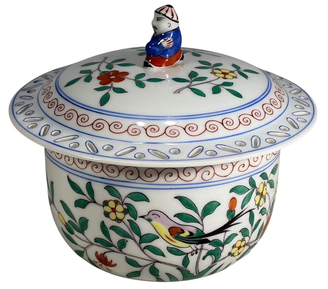 Herend Chinoiserie Openwork Porcelain Lidded Bowl: Herend Hungarian hand-painted porcelain lidded bowl in Chinoiserie style with lattice decoration, bird and floral motifs, and a Chinese boy finial. Marked 'Herend Hungary, Handpainted, 2663'. Dimensio