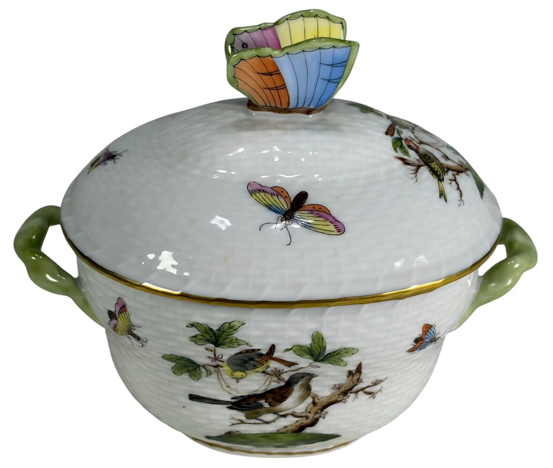 Herend Rothschild Bird Porcelain Sugar Pot: Herend porcelain sugar pot in the Rothschild Bird pattern, hand-painted with birds and insects, butterfly finial, green branch handles, and gilt rims. Model 6018. The underside bears the blue Herend H