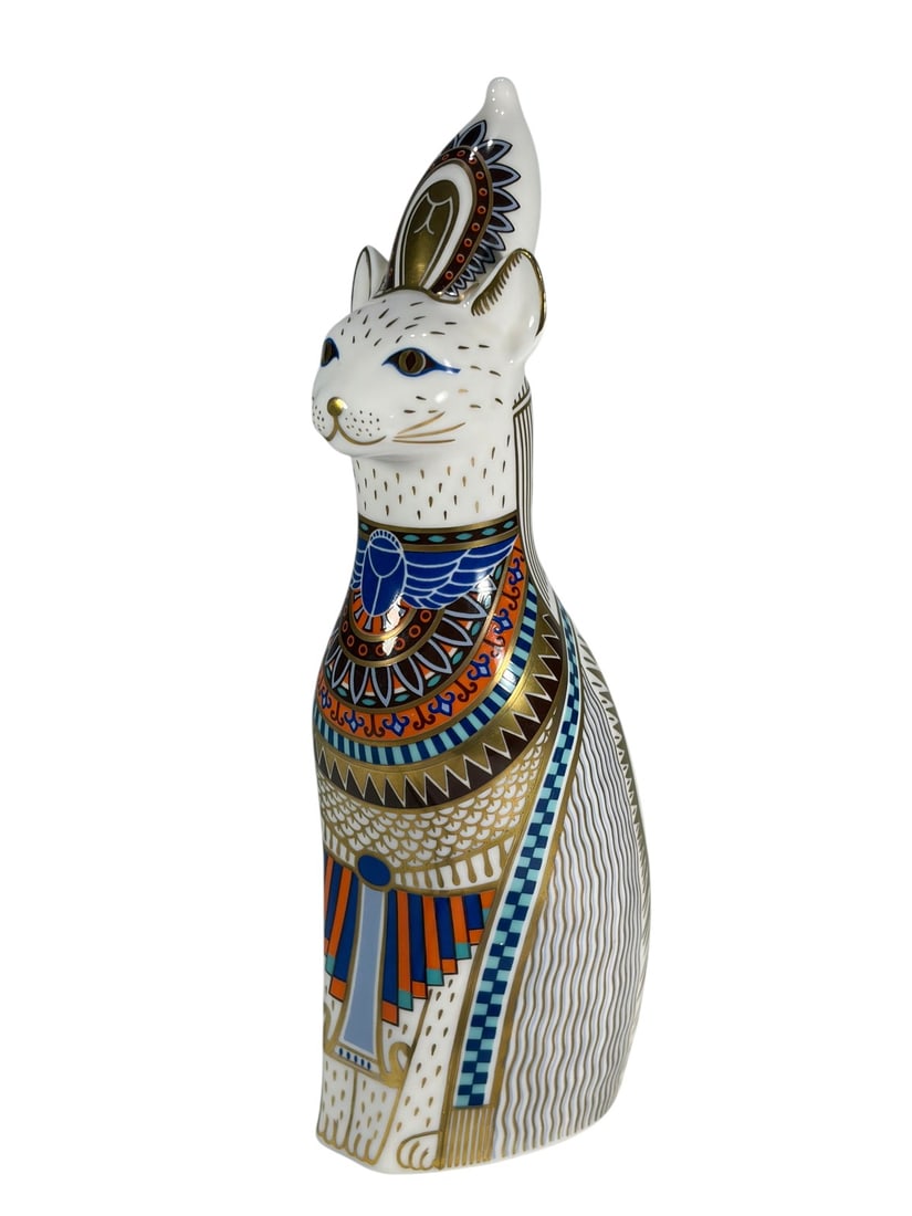 Royal Crown Derby Egyptian Royal Cat Figurine: Royal Crown Derby 'Egyptian' cat, 1986 Royal Cats Collection, hand-painted in cobalt blue, orange, and turquoise with gilt hieroglyphic and geometric motifs. Underside is stamped with red Royal Crown 