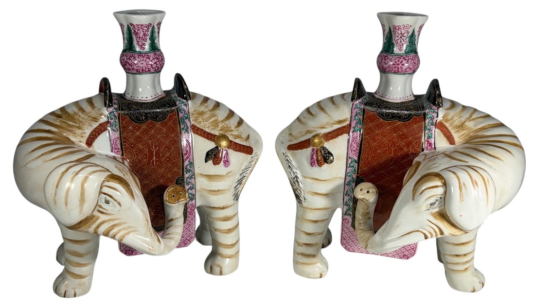 Pair of Mottahedeh Elephant Porcelain Candlesticks: Pair of Mottahedeh porcelain elephant candlesticks, hand-painted in Famille Rose enamels with gilt accents. Undersides are stamped 'Winterthur Reproduction Mottahedeh' in black. Each piece measures ap