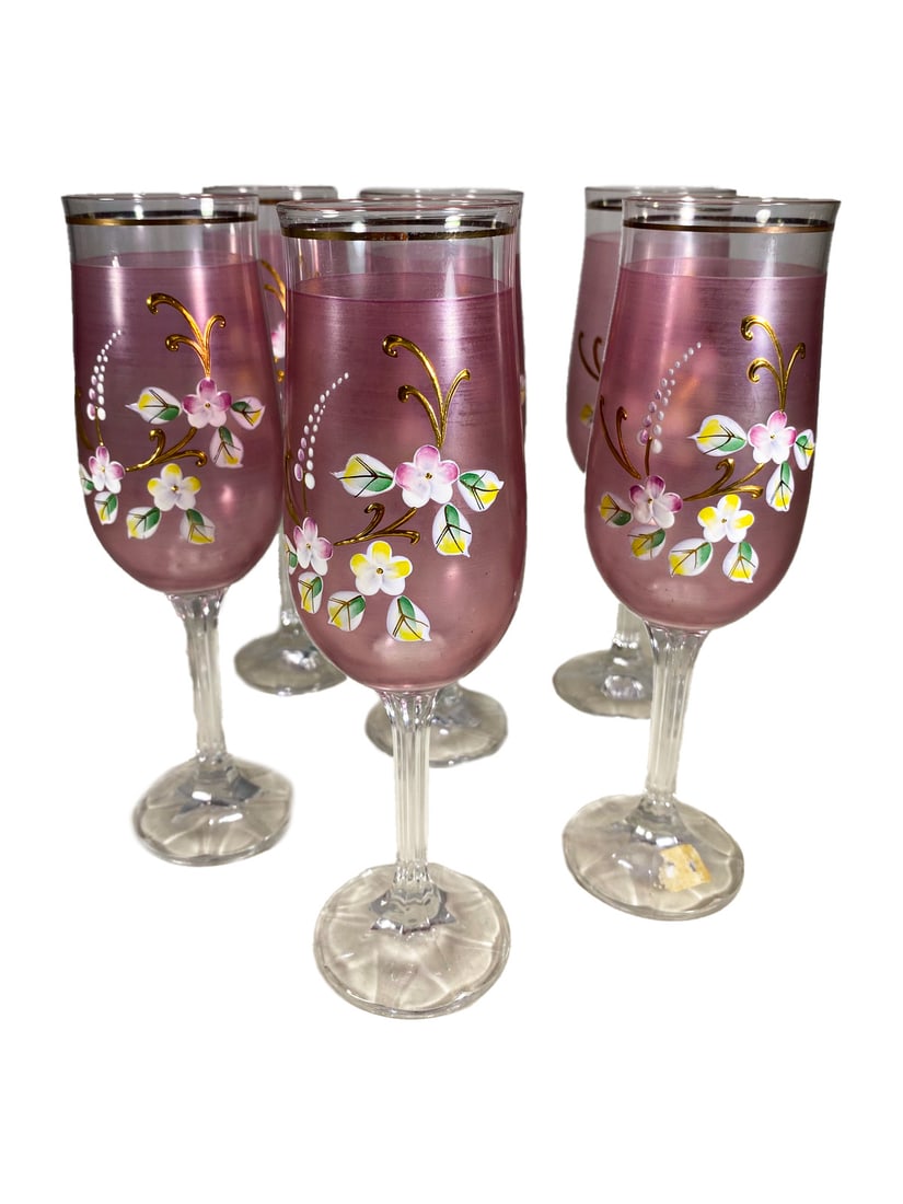 Venetian Purple Hand-Painted Wine Glasses 6pc LOT: Six Venetian-style purple wine glasses hand-painted with enamel floral motifs and gilt details, with clear faceted stems and smooth rims. Each piece measures approximately 7.5 inches high by 2.25 inch