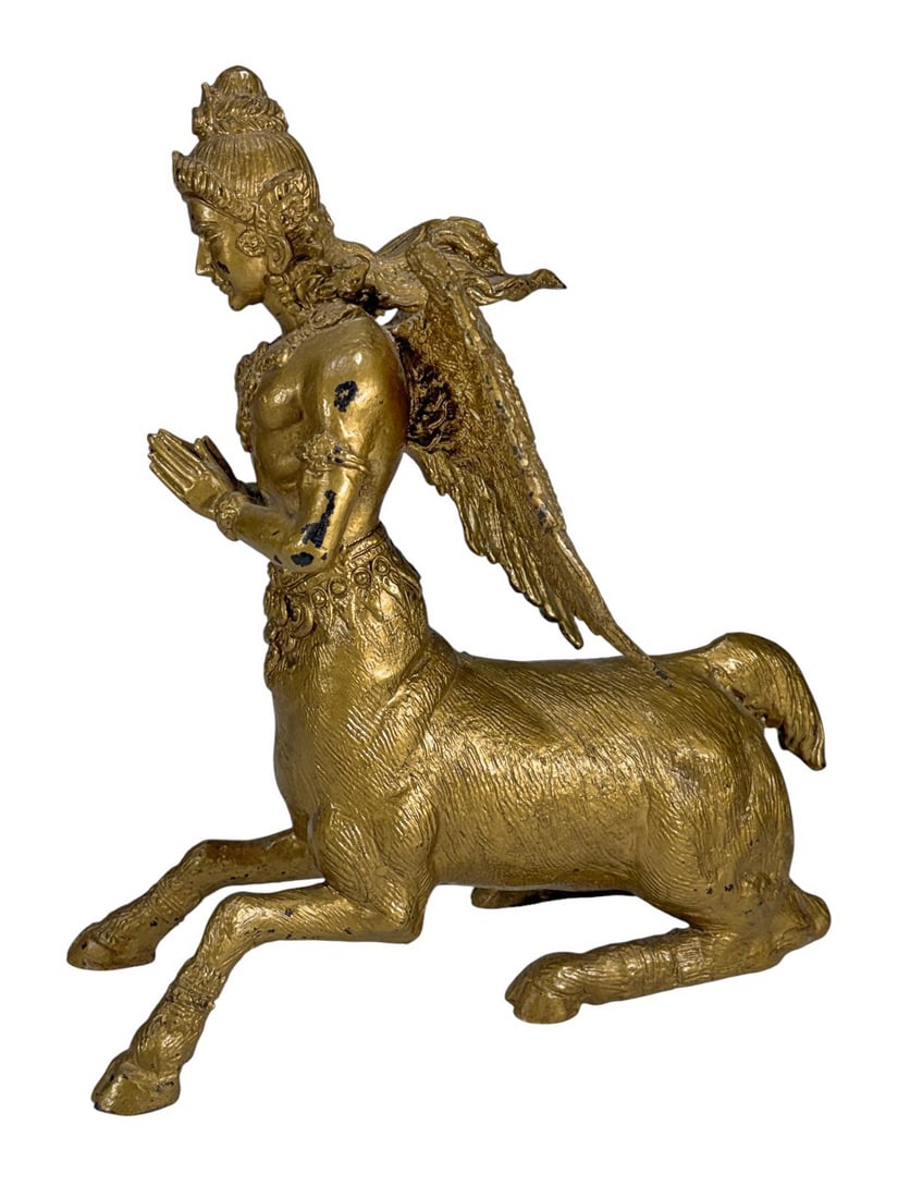 Asian Kinnara Mythological Celestial Bronze Fig: Gilt bronze sculpture of a Kinnara, the half-human, half-horse celestial being, kneeling in anjali mudra with detailed jewelry, headdress, and finely modeled wings and garments.Dimensions: 11 X 9.25 X