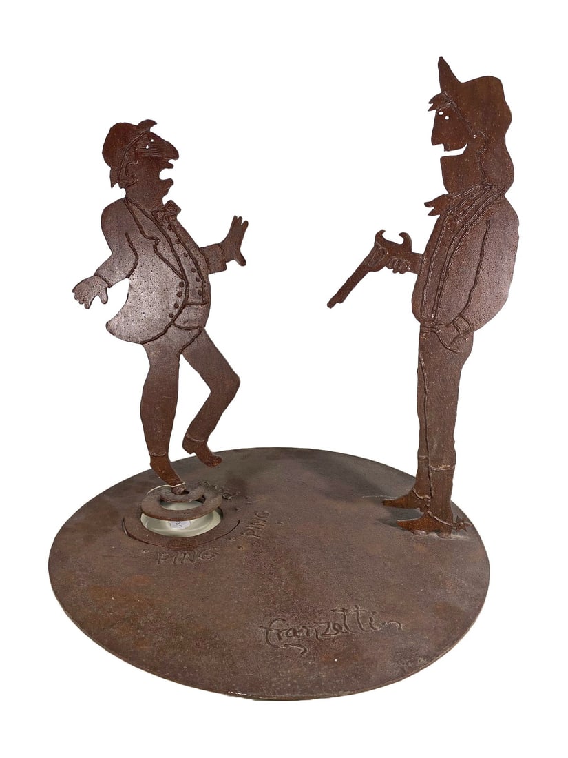 Rosemary Pozzi Franchetti Metal Sculpture: Cut and welded metal sculpture depicting two Western-style figures in a humorous standoff scene. Crafted in rustic patinated metal with engraved sound text 'PING.'Dimensions: 19.25 X 17.5 X 17.5 in. C
