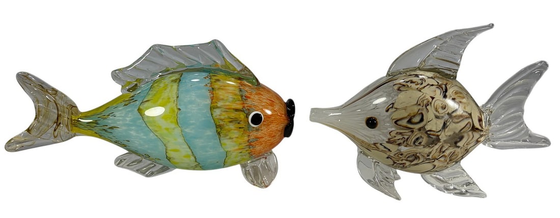 Italian Murano Glass Fish Figurines 2pc LOT: Pair of Italian Murano hand-blown glass fish with clear fins, one in orange and turquoise stripes, the other in cream and brown marbled tones. The largest measures approximately 7.5 inches tall by 9.5