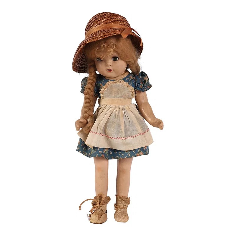 Composition Jointed 15" Doll Sleep Eye Open Mouth: Composition doll with jointed limbs, sleep eyes, open mouth with teeth, and blonde braided wig under a straw hat. Dressed in a blue floral print dress with lace trimmed apron, socks, and shoes. No app