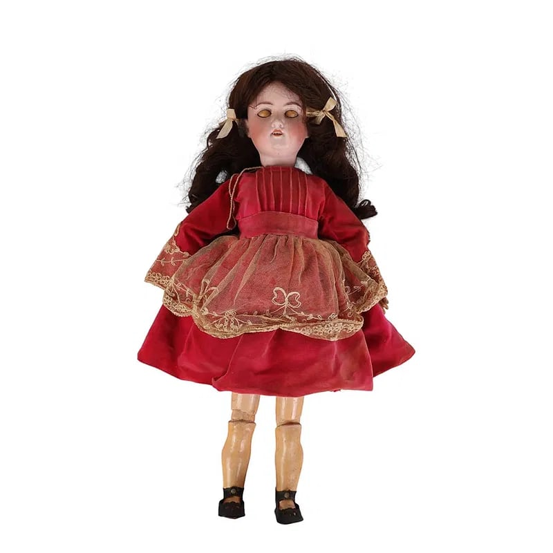 Armand Marseille Antique 22" Doll with Sleep Eyes: Armand Marseille Germany early 20th century doll modeled with a bisque porcelain head, blue sleep eyes, painted brows and lashes, and open mouth with teeth. Wears a dark colored wig, red velvet dress
