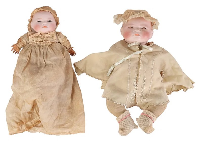 Grace Putname Bisque Bye Lo Baby Dolls Swivel Neck: Pair of early 20th century Bye Lo Baby dolls with swivel necks by Grace Storey Putnam. One with sleep eyes and one with fixed painted eyes. Both have painted bisque heads with blushed cheeks, closed m