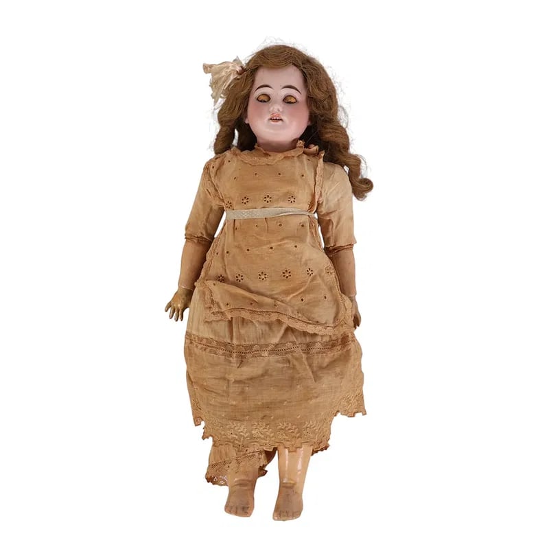 Antique 19" Sleep Eye Porcelain & Composition Doll: Antique German doll early 20th century modeled with bisque porcelain head, sleep eyes, painted brows and lashes, open mouth showing teeth, and blushed cheeks. Retains a wavy wig tied with ribbon. Dres