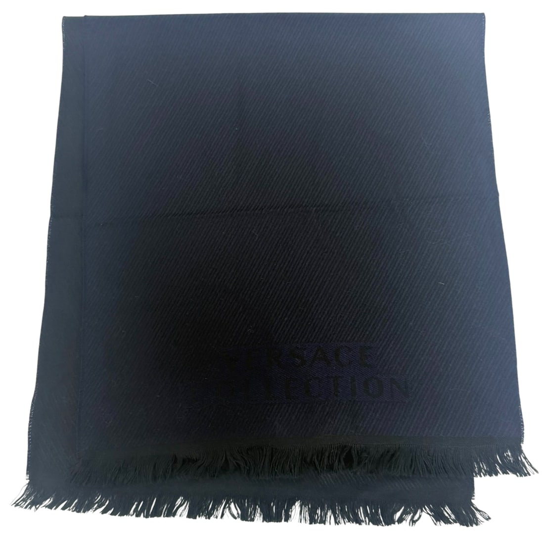Versace Collection Black Wool Scarf / Shawl: Versace Collection black wool scarf featuring a tonal woven pattern with subtle diagonal ribbing and the brand's name integrated into the fabric at one end. The edges are finished with short fringe an