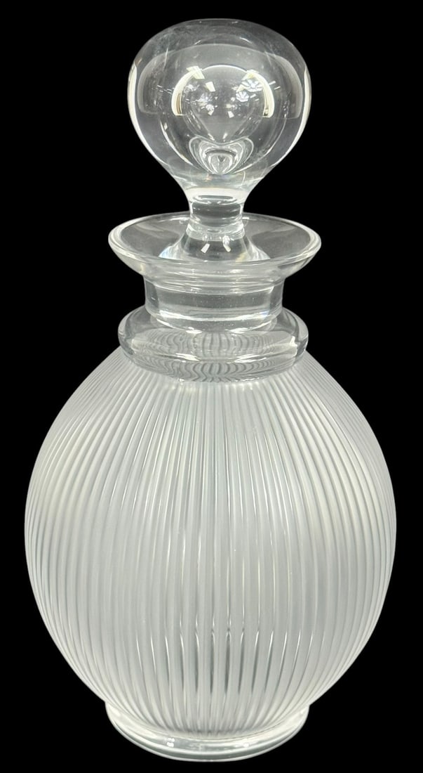 Lalique French Crystal Langeais Decanter w Stopper: Lalique French crystal liquor decanter done in the 'Langeais' pattern. This elegant piece features a ribbed frosted glass body with vertical fluting, echoing the same sculptural design found in the ic