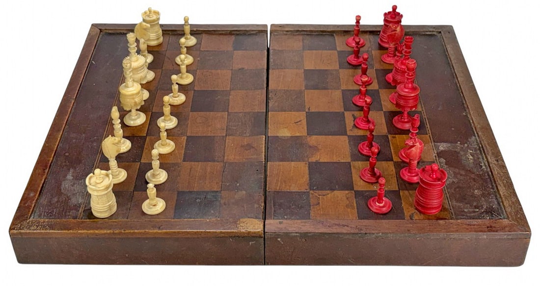 Vintage Chess & Backgammon Bone & Wood Game Sets: Pair of vintage chess game sets housed in a hinged wooden box: one carved organic-material set in natural and red stain, and one carved wood set in light and dark tones. Interior includes an inlaid ba