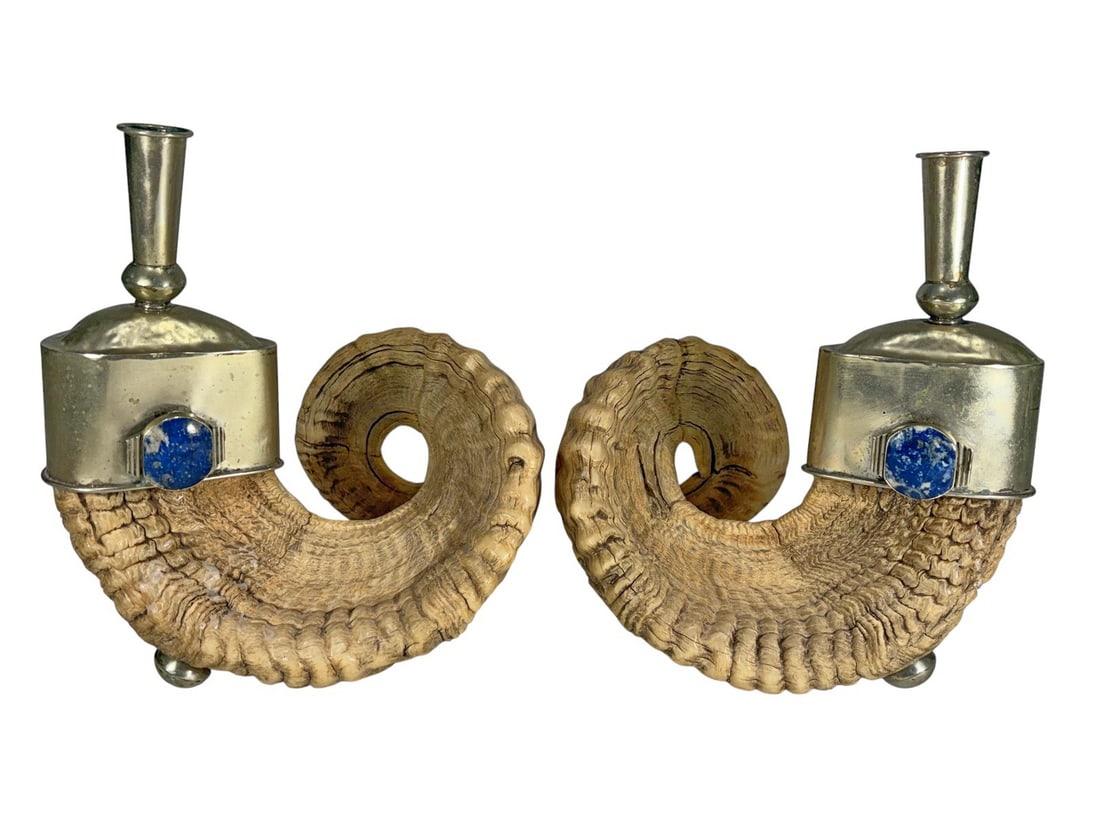 Pair of Ram Horns, Metal Lapis Lazuli Candlesticks: Pair of natural ram horn candlesticks with metal candle cups and ball feet, each accented with a lapis lazuli cabochon. Each piece measures approximately 9.25 inches tall by 8 inches wide by 8 inches