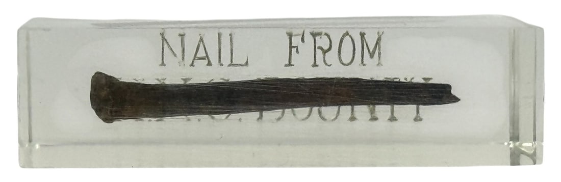 Antique Nail Encased in Lucite from H.M.S. Bounty: A rare historical artifact consisting of a rusted iron nail embedded in a clear Lucite block, with the inscription 'NAIL FROM H.M.S. BOUNTY' etched into the surface. This presentation piece commemorat