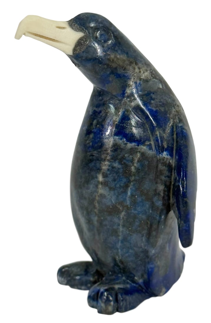Lapis Lazuli Penguin Carving w/ a Carved Bone Beak: 20th century, hand-carved penguin sculpture crafted from a deep blue lapis lazuli stone with natural gray and gold veining throughout. The penguin features a contrasting beak made of carved bone. Dime