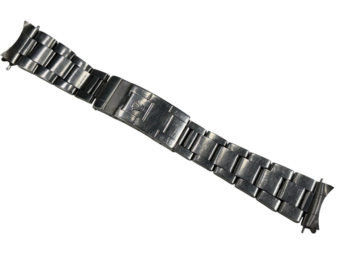 Vintage Rolex 1971 Replacement Watch Band: Vintage 1971 Rolex stainless steel Oyster-style replacement bracelet with folding clasp, Rolex crown and hallmarks, and included end links and spring bars. The measures approximately 8.75 inches tall