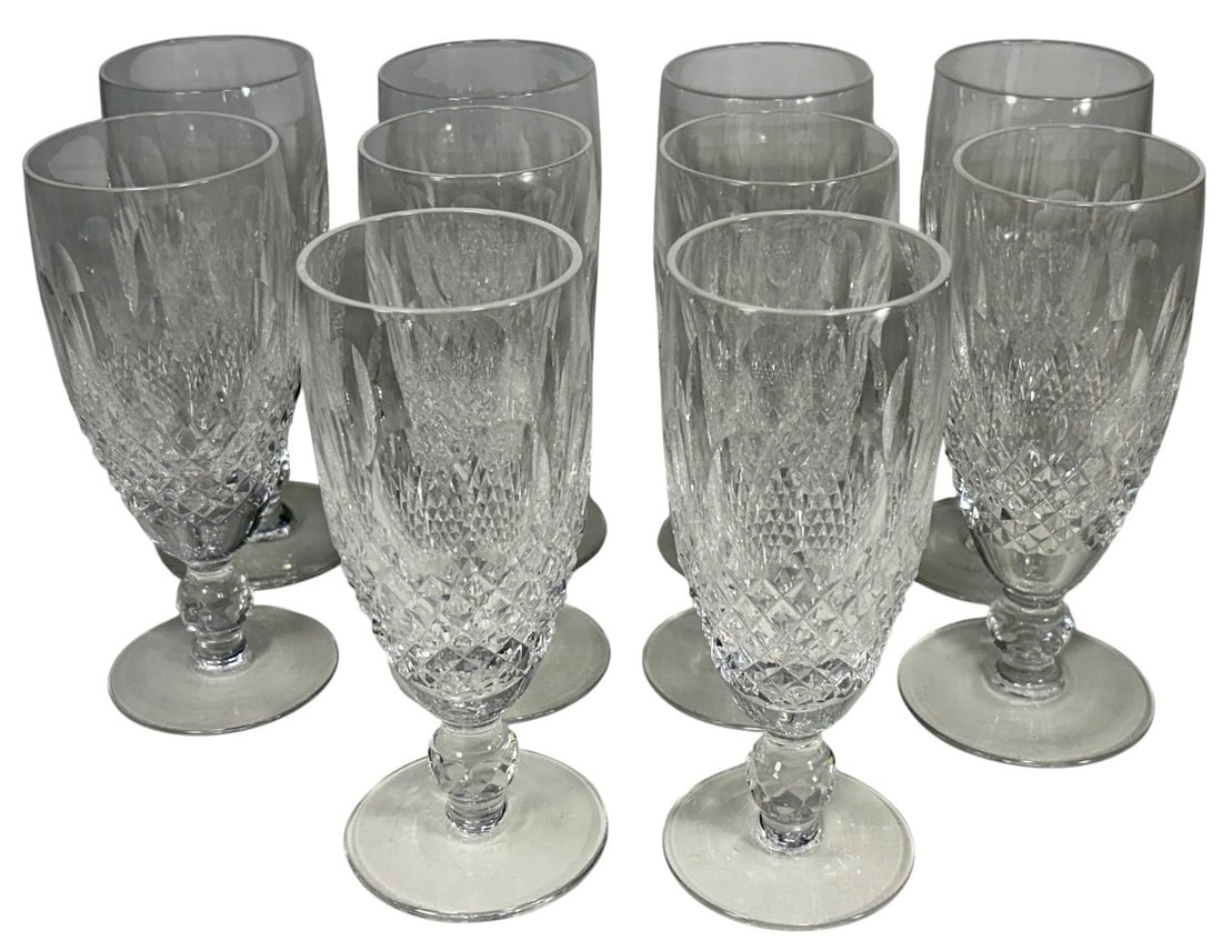 Waterford Colleen Crystal Champagne 10pc LOT: Ten Waterford Colleen crystal champagne glasses with elongated bowls, oval thumbprints, cross-cut diamond panels, and faceted stems. All with acid-etched Waterford marks on its bases. Each piece measu