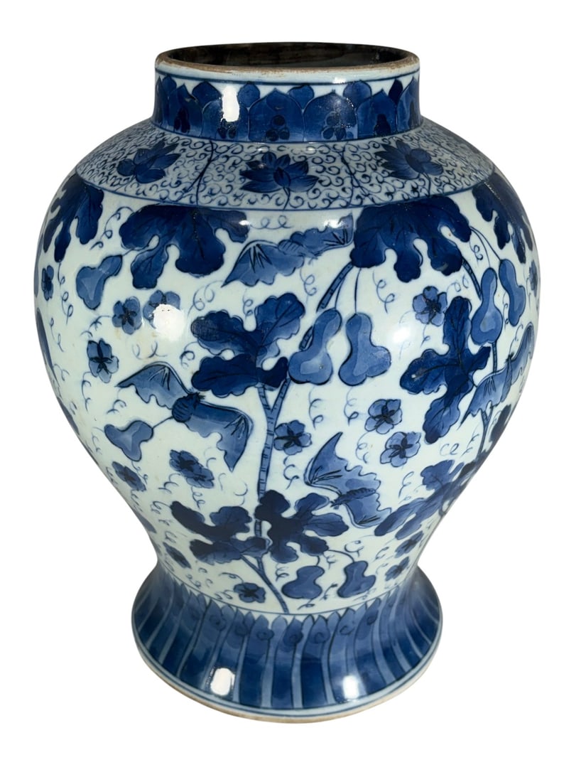 Chinese Blue & White Porcelain Floral Vase: Bulbous Chinese blue-and-white porcelain vase with flared foot and short neck, decorated with scrolling vines, lotus flowers, and double-gourd motifs, with floral shoulder band and lappet foot design.