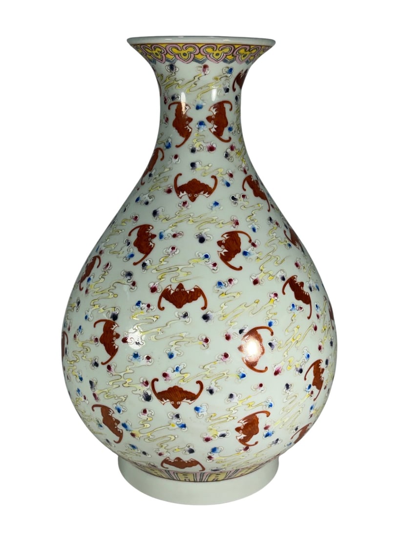 Chinese Famille Rose Fu Bats Porcelain Vase: Chinese famille rose porcelain vase with bulbous body and flaring neck, decorated with iron-red fu bats among multicolor scrolling clouds, with pink and yellow borders.Dimensions: 12 X 7.25 X 7.25 in.