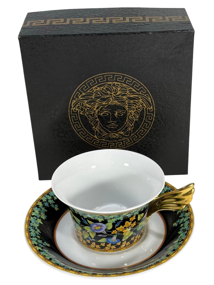 Rosenthal Versace Gold Ivy Studio Line Cup Saucer: Rosenthal Versace 'Gold Ivy' 2-piece tea cup and saucer set, designed by Paul Wunderlich in the Ikarus form and produced in Germany. Featuring a vibrant ivy and floral pattern on a black ground with a