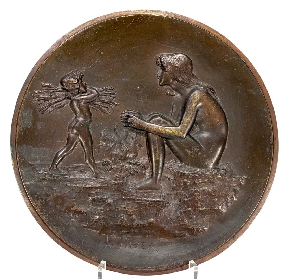 Aristide O. Croisy b.1840 L'Hiver Bronze Charger: Aristide Onesime Croisy (French, 1840 - 1899), patinated bronze charger titled 'L'Hiver' (Winter) with high-relief scene of a nude woman warming by a fire and a child carrying kindling. Inscribed